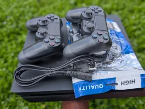 PS4 Slim Console with 2 Controllers & 7 Games