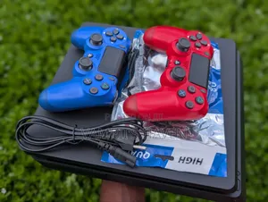 PS4 Slim Console with 2 Controllers & 7 Games
