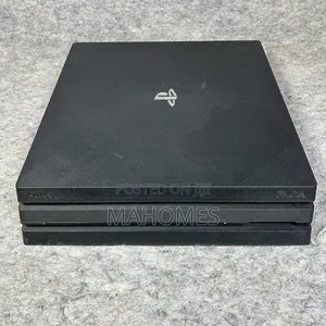 PS4 Pro with 2 Controllers and 8 Games