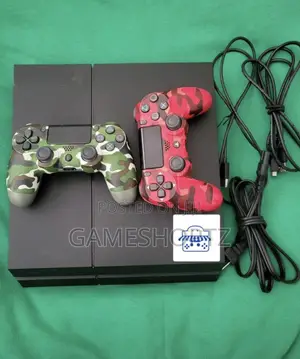 Used PS4 Fat Console with 2 Controllers & 8 Games