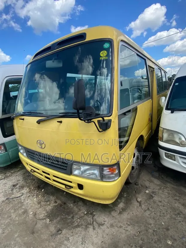 Toyota Coaster 2004 - Yellow - 1