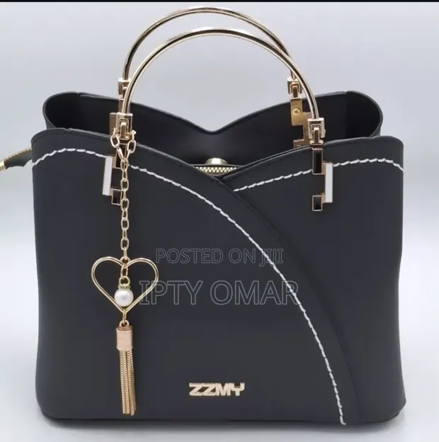 Chic Black Handbag with Heart Charm - 1