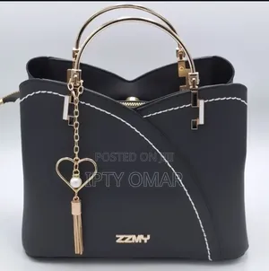 Chic Black Handbag with Heart Charm