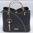 Chic Black Handbag with Heart Charm - 1