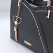Chic Black Handbag with Heart Charm - 2