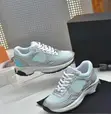Chanel Silver Metallic CC Logo Sneakers - 1
