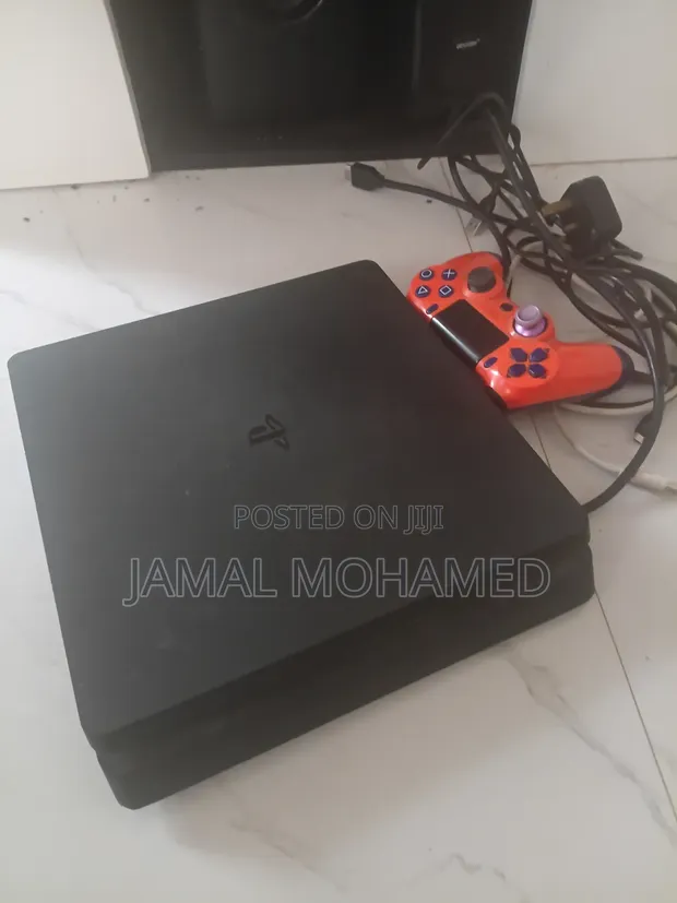 Playstation 4 Slim with 5 Games and Controller - 1
