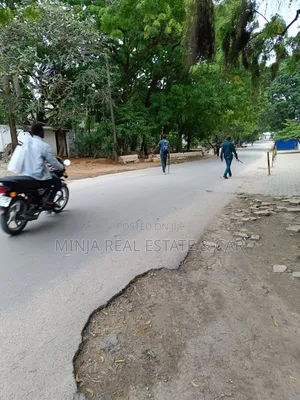 Plot with 2-Floor Building for Sale in Masaki