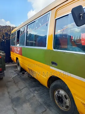 Toyota Coaster 2002 - Yellow
