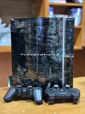 PS3 Fat Console with 2 Controllers & 10 Games