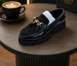 Men's Gucci Black Patent Tasseled Loafers - 1