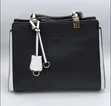 Black and White Handbag with Gold Accents - 1