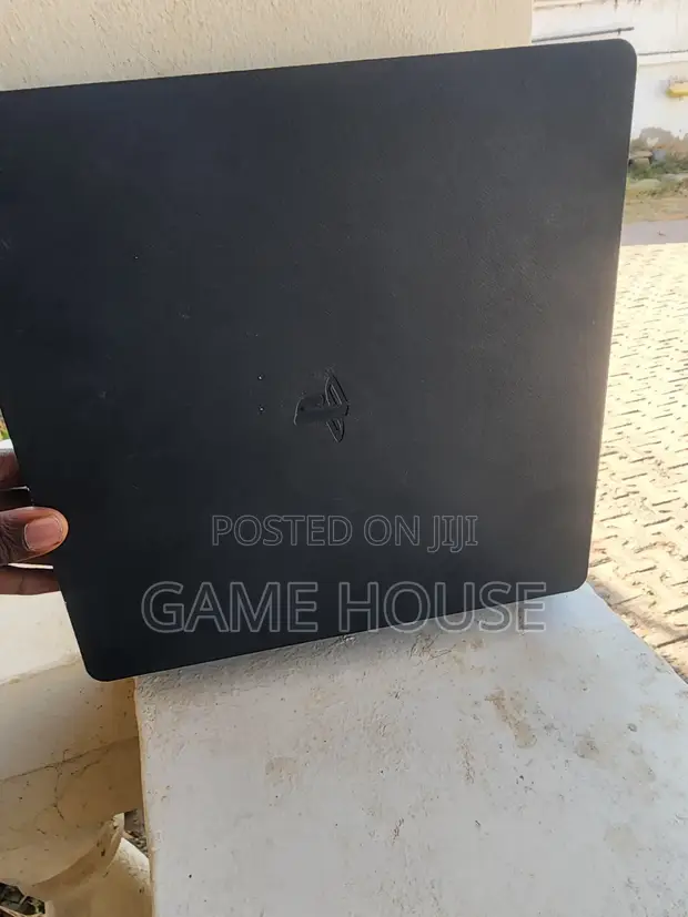 PS4 Slim 512GB with 4 Games and One Controller - 1