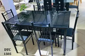 Brand New Glass and Stainless Steel Dining Set (1 Table + 6 Chairs)