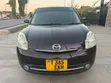 Mazda Verisa 2010 Rangi ya Maroon - 1