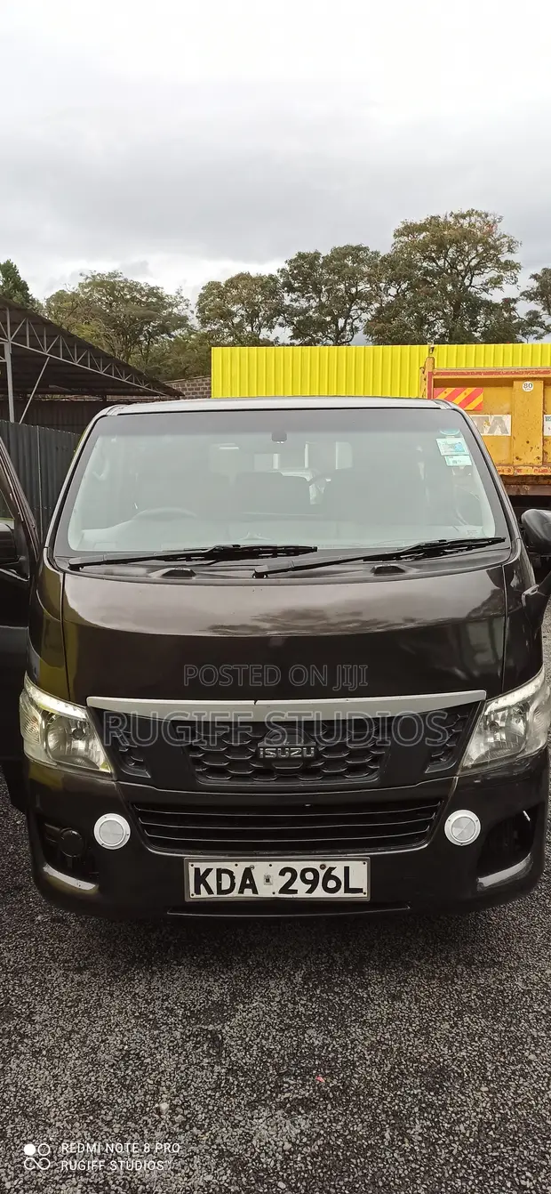 Isuzu Como Van 2013 Brown - 1