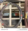 Black Nissan Textured Grip Steering Wheel Cover - 1