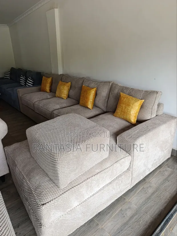 7-Seater L-Shaped Cream Sofa with Ottoman - 1