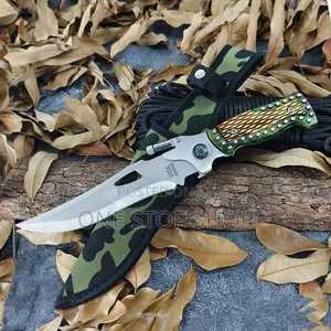 Serrated Stainless Steel Outdoor Knife with Green Textured Handle and Sheath