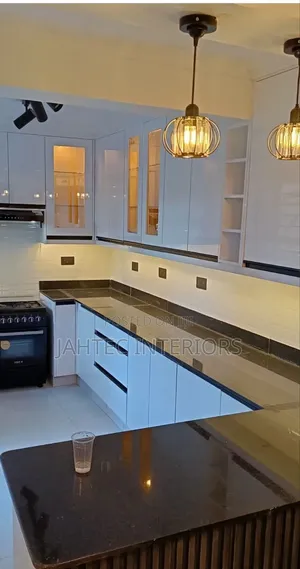 Professional White & Black Kitchen Cabinet Fitting Service in Ruaka