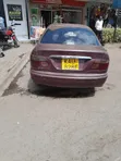 Nissan FB14 1999 Rangi ya Maroon - 2
