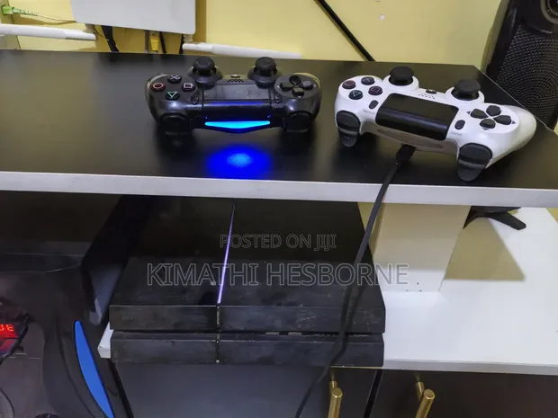 PS4 Standard Version - Chipped with 9 Games & 2 Controllers - 1