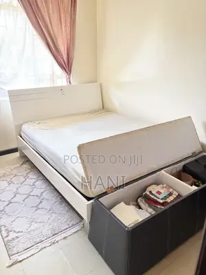 Used 5x6 Wooden Bed with Ottoman and Mattress