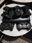PlayStation 3 1TB with 27 Games & 5 Controllers - 1
