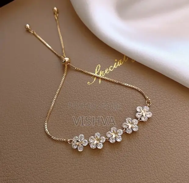 Adjustable Gold-Tone Bolo Bracelet with Floral Charms - 1