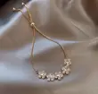 Adjustable Gold-Tone Bolo Bracelet with Floral Charms - 2