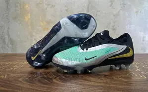 Nike Jr. Phantom GX Academy Football Shoes (Kids Sizes 30-35)
