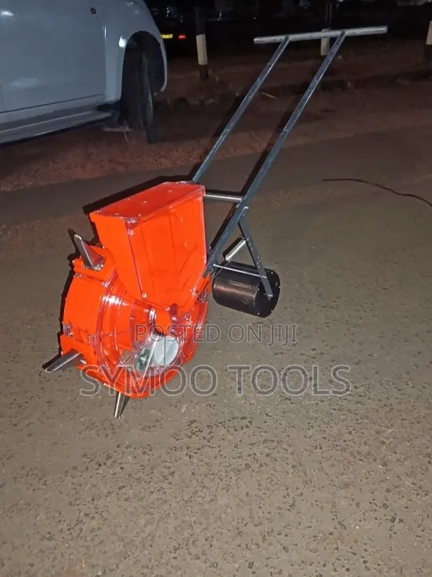Manual Hand-Push Roller Seed and Fertilizer Planter - 1