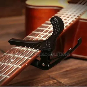 Brand New Clip-on Guitar Tuner with Capo and Picks