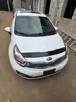 Kia Rio SX 4dr Sedan (1.6L) 2014 Fari - 1