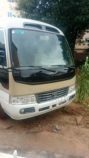 Toyota Coaster Bus 2022 Gold
