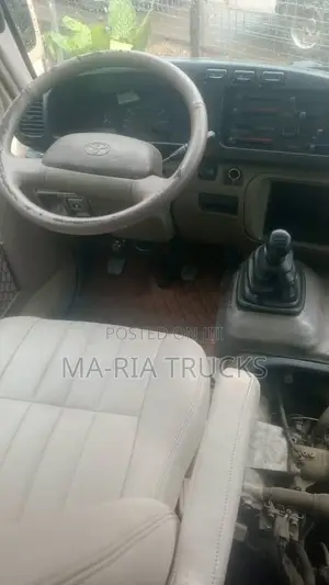 Toyota Coaster 2017 Bus - Gold