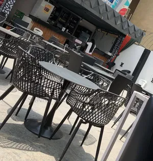 Modern Outdoor Dining Set with Woven Mesh Chairs