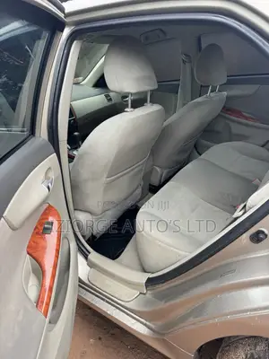 2010 Toyota Corolla LE Sedan - Gold